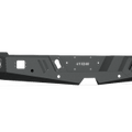The 2010-2018 Ram 2500 Spartan Rear Bumper by Road Armor features a matte black textured finish, angular contours, geometric lines, cutouts, and reinforced sections for off-road durability.