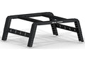 The 2005+ Nissan Frontier Treck 5Ft. Adjustable Bed Rack System for mid-size truck beds features a heavy-duty, perforated black metal frame with angled legs, multiple mounting holes, and a “ROAD ARMOR” logo on the front crossbar. Bracket kit included.
