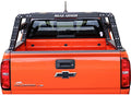 Rear view of an orange Chevy Colorado truck with a 2015+ GMC Canyon Treck 5Ft. Adjustable Bed Rack System (Texture Black) installed. The bed rack has a ROAD ARMOR style, and the bed is empty. Stickers appear on the rear window.