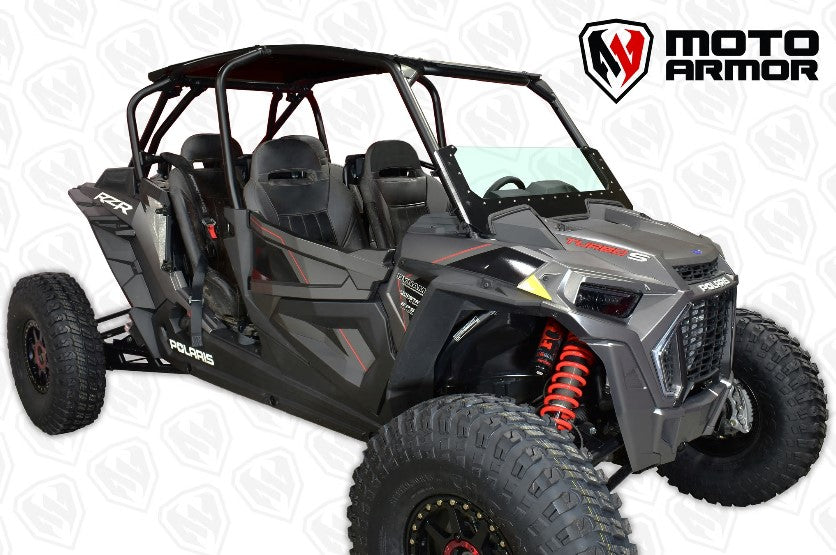 A rugged black Polaris RZR with red shocks and large knobby tires is shown at an angle. It seats four, features visible safety harnesses, and displays the Moto Armor logo above a patterned background. Equipped with the Rzr 2019+ Glass Half Windshield.