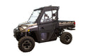 A Polaris Full Size Pro-Fit Ranger XP 1000 (new body style) with Framed Door Kit, black and tan body, large tires, closed cab, Ranger branding, transparent doors/windows showing two seats, viewed from the side on white background.