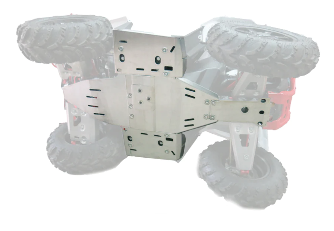 A Polaris Scrambler 850 / XP 1000 Alloy Central Skid Plate is mounted beneath an off-road RC car, protecting the chassis. The car is flipped upside down, revealing large, rugged tires and red suspension components in the background.
