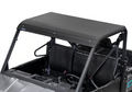 A close-up of the Cf Moto U Force 1000 Alloy Roof By Rival installed on a side-by-side, showing two black bucket seats, steering wheel, protective roll bars, and a partially visible dashboard with cup holders.