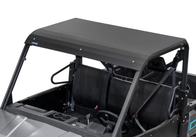 A close-up of the Cf Moto U Force 1000 Alloy Roof By Rival installed on a side-by-side, showing two black bucket seats, steering wheel, protective roll bars, and a partially visible dashboard with cup holders.