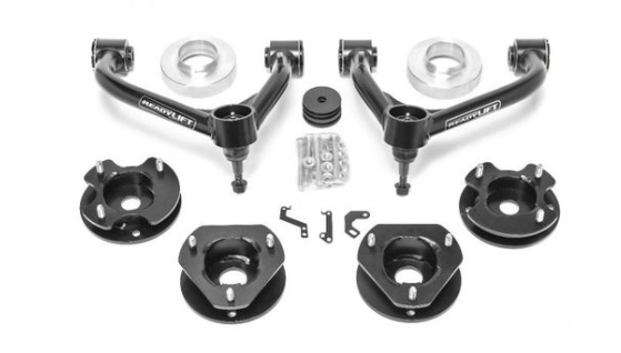 A 2021-2022 CHEV/GMC TAHOE/SUBURBAN/YUKON 3.0IN SST Lift Kit w/ Magnetic Ride Control, shown on a white background with 2 upper control arms, 4 spacers, 4 black brackets, hardware bolts, washers, 2 small brackets, and 2 rubber bushings.