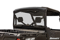 A rear view of a black Can-Am utility vehicle displays the Can-Am Defender Rear Windshield by SuperATV, featuring a clear, vented design with two open vents, black frame, and cargo bed. The SuperATV logo appears in the lower right corner.