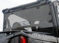 Close-up of the Polaris General Rear Vented Windshield-Tinted-Gp 2016+ on a black vehicle, showing its tinted transparent glass, latch hinges, angular frame, part of a tail light, and the “GENERAL” logo with stars at the bottom right.