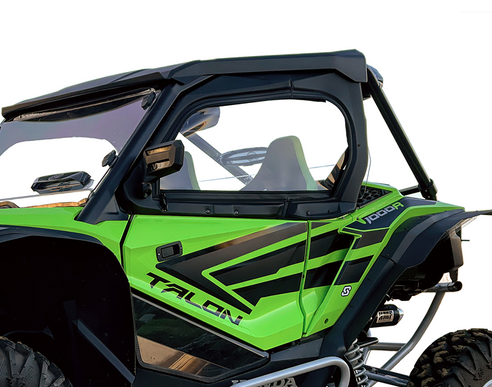 A Honda Talon Upper Door Kit is shown installed on a bright green off-road vehicle with black accents, large tires, a metal roll cage, side mirror, and visible seat beneath a hard roof—all set against a plain white background.