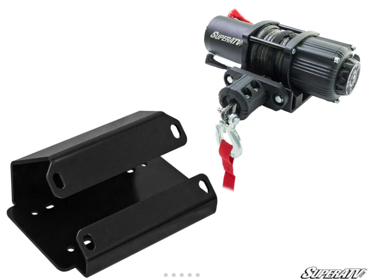 The Can Am Defender Winch Mount +3500lb Winch, in black metal with cable, hook, and red strap, sits above a matching black mounting bracket. Both appear on a white background with the SuperATV logo at the bottom right.
