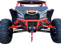 Close-up front view of a Can Am Maverick X-3 (2017+) with Over Fenders (Set of 4), featuring rugged tires, exposed suspension, a winch with red strap, angular grille and headlights under a protective roof.