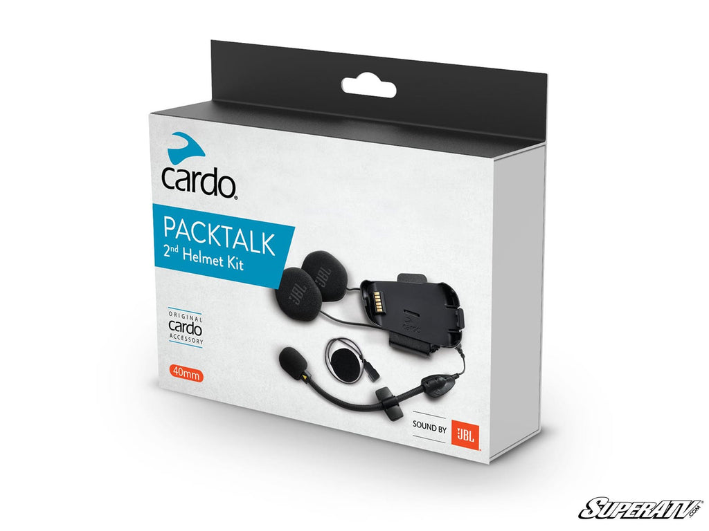A white retail box labeled Cardo Packtalk Edge 2nd Helmet Kit displays images of helmet audio gear like speakers and a mic. “Original cardo accessory” and “Sound by JBL” are highlighted. The box has a clean look with blue and orange accents.