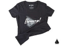 The Assault Industries Braaap Womens Tee is a black t-shirt with a bold geometric triangle logo reading Braaap! in white script and ASSAULT NO. below. The collar tag reads ASSAULT, and a small triangle logo accents the bottom right corner.