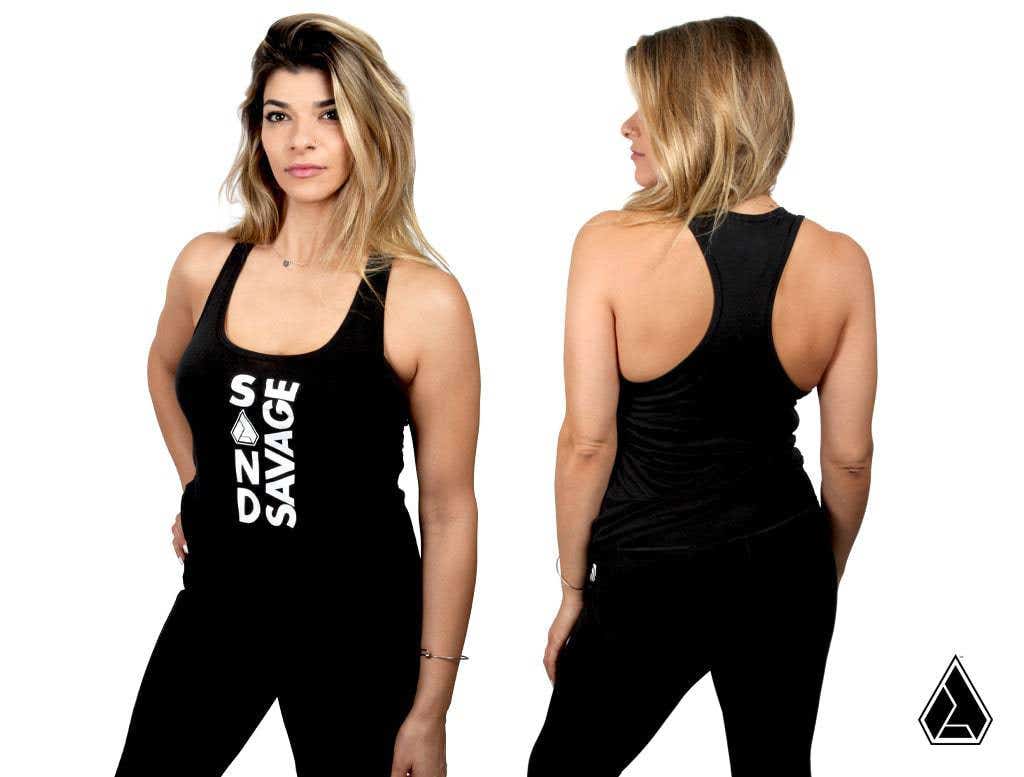 Front and back views of the Assault Industries Womens Sand Savage Logo Tank Top in black, featuring bold vertical white SAVAGE text on the front and a racerback design. Both images are set against a plain white background.
