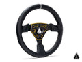 The Assault Industries Universal Navigator Leather UTV Steering Wheel features black leather, a yellow-trimmed three-spoke metal center, decorative stitched grip, and a logo in the middle and the bottom right against a white background.