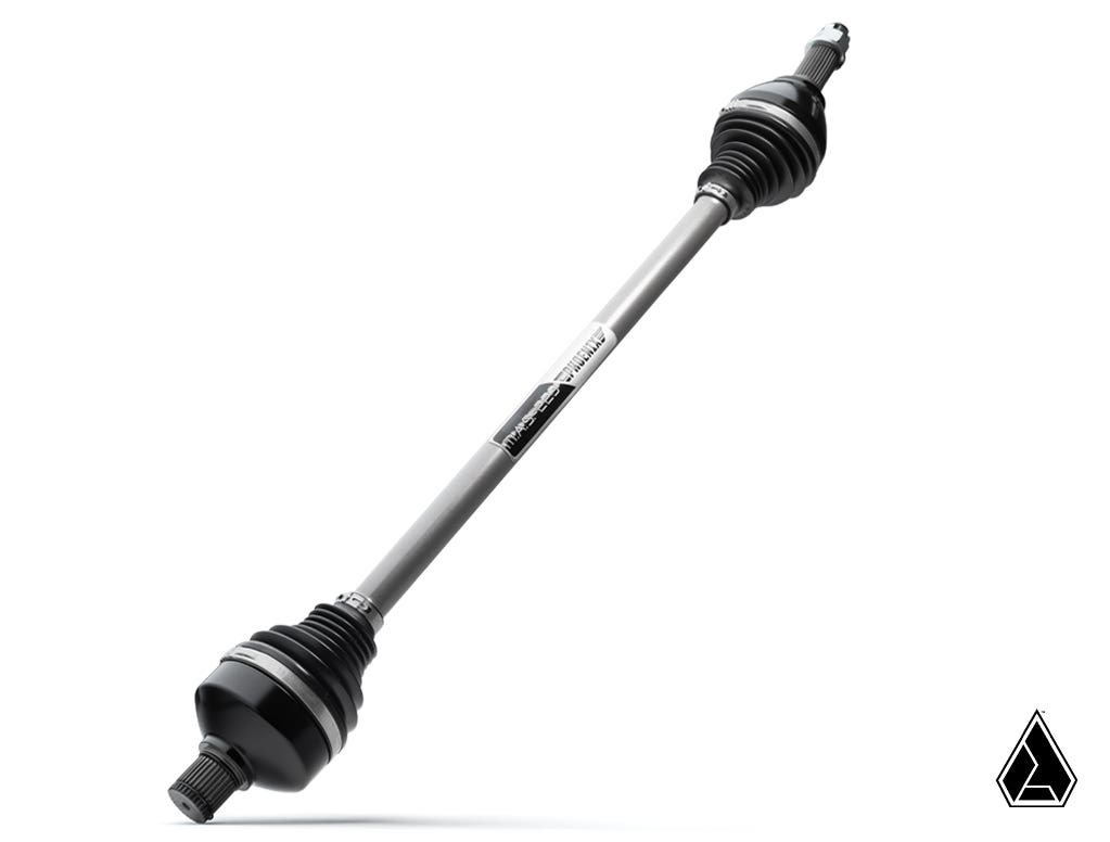 The Assault Industries MAS-223 Phoenix Axle for Polaris RZR Pro XP is shown against a white background, featuring cylindrical design, black CV joints with rubber boots, a visible product label on the shaft, and a geometric logo in the bottom right corner.