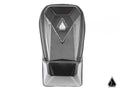 The Assault Industries RUXAK Glovebox for Can Am Maverick X3 features a sleek black carbon fiber look with a textured finish, geometric silver logo on the front, molded angular design, and a modern, minimalistic style.
