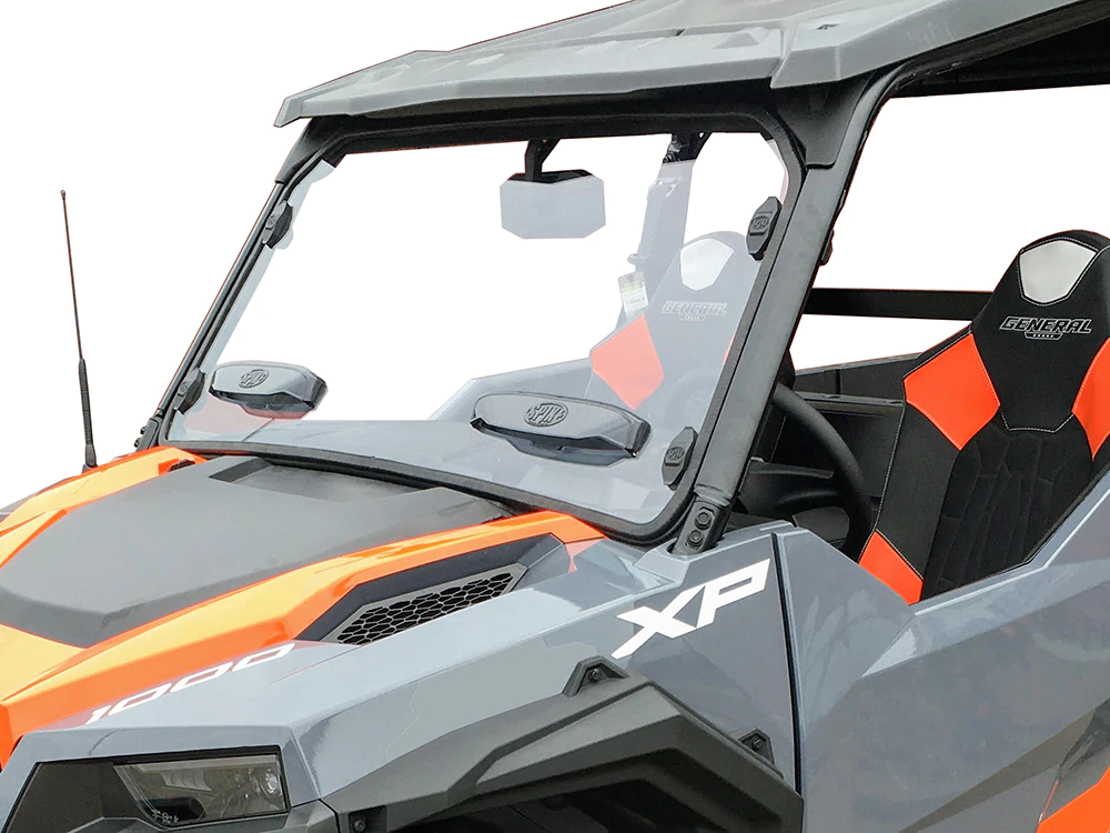 A close-up of a Polaris General Full Size Scratch Resistant Windshield With Sliding Vent (2016+) installed on a gray and orange off-road vehicle, highlighting the windshield, side mirror, XP and General logos, seat, and front driver’s side.