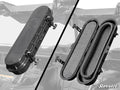 The UTV Belt Case is shown closed on the left and open on the right, revealing its foam-lined interior. It features four side latches and displays the SuperATV logo, with an off-road vehicle roll cage in the background.