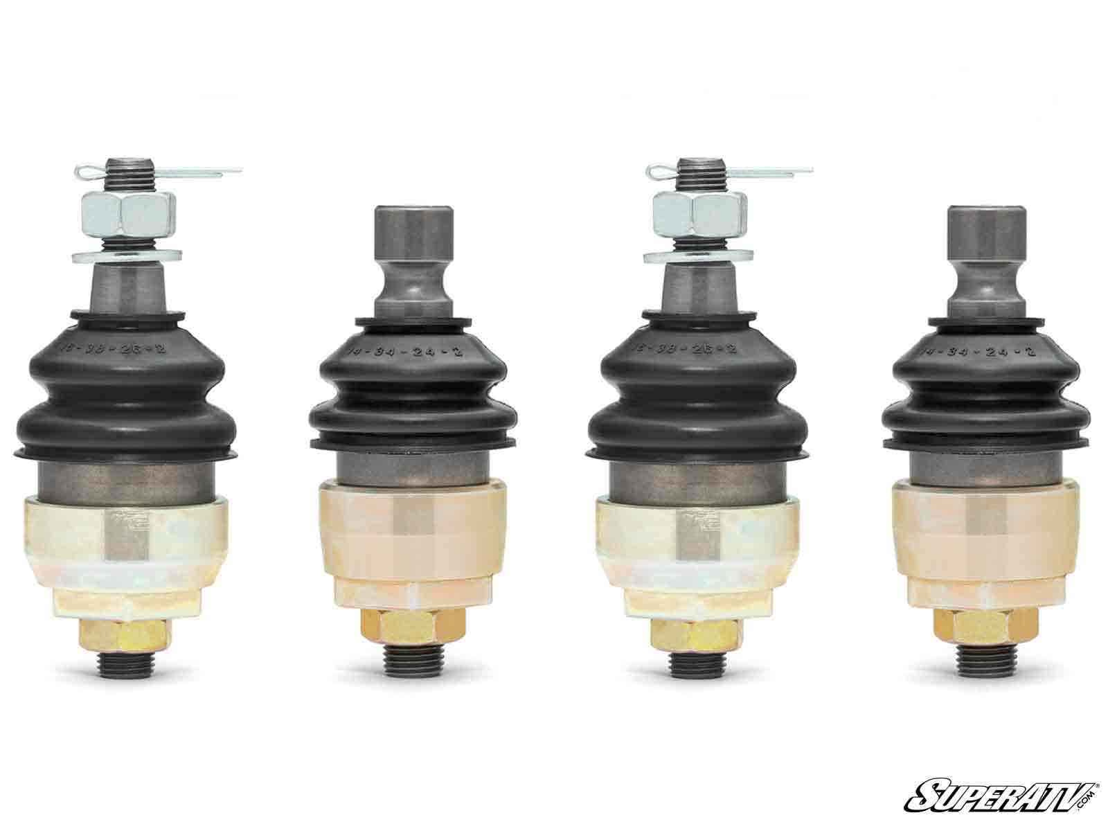 Four Can-Am Commander Keller Ball Joints stand upright against a white background, each featuring a black rubber boot, metal housing, and beige base. The SuperATV logo is in the lower right corner; all parts are evenly spaced and aligned.