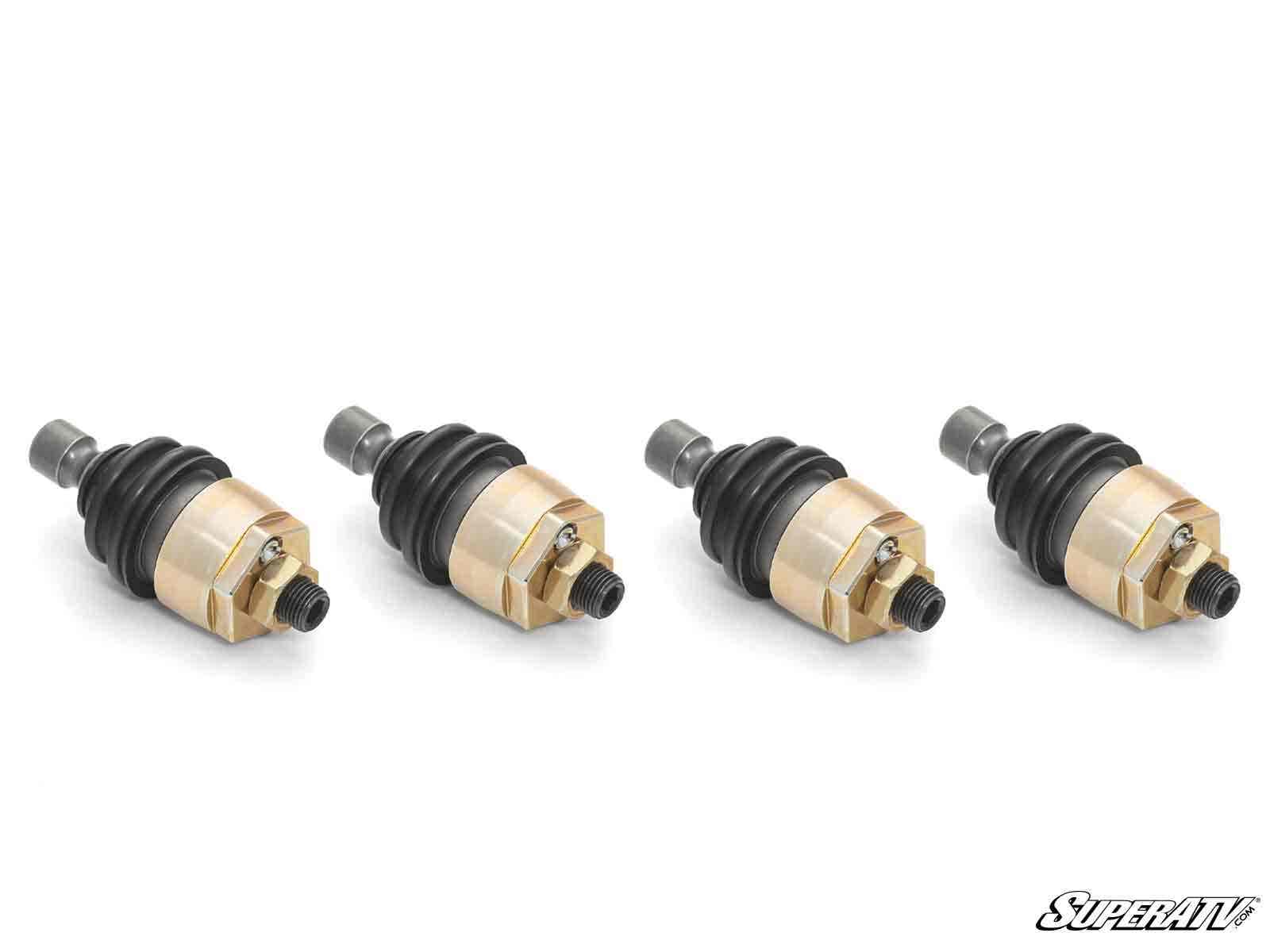 Four Polaris RZR XP Turbo Keller Ball Joints with gold-toned housings, black rubber boots, and threaded studs are lined up on a white background. The “SuperATV” logo appears in the bottom right corner.