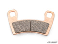 A single Polaris General Brake Pad, copper-colored with two rectangular friction surfaces and two mounting holes, is shown on a white background. “SuperATV” appears in stylized text in the lower right corner.
