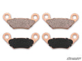 The image features two pairs of Polaris Scrambler Sintered Brake Pads with copper backing plates in two rows—friction surfaces on top, copper backs below. The “SuperATV” logo appears in the lower right corner.