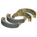 Three gold-colored metallic Golf Cart Brake Pads and Shoes, each with dark gray, textured friction linings, are arranged in a slightly overlapping row on a transparent background.