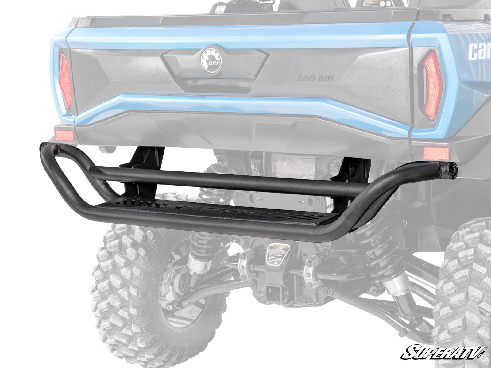 A Can-Am Commander 1000 Rear Bumper made of black tubular steel with a step is installed on the back of a blue off-road vehicle with lifted suspension and large tires. The SuperATV logo appears at the bottom right. Background is white.
