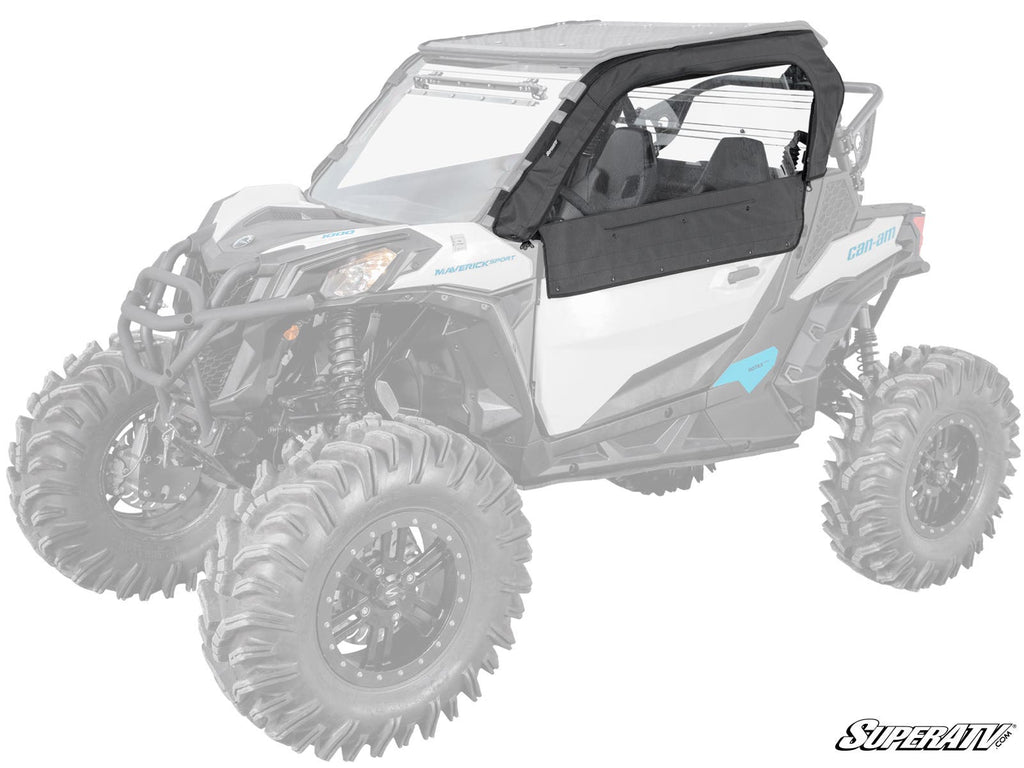 The driver’s side of a white off-road vehicle with large rugged tires features the Can-Am Maverick Sport Primal Soft Cab Enclosure Upper Doors in black. The faded vehicle highlights this accessory. The SuperATV logo is visible in the lower right corner.