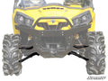 Front view of a yellow off-road utility vehicle with large, rugged tires, black bumper, angular headlights, and visible suspension featuring Can-Am Commander High Clearance 1.5 Forward Offset A-Arms. SuperATV logo is in the bottom right corner.