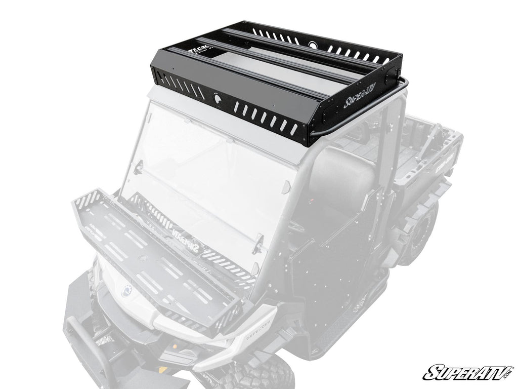 A Can-Am Defender Outfitter Roof Rack in black metal is installed on a white off-road utility vehicle. The rack features slotted sides, crossbars for cargo, and a sturdy angular design. The vehicle appears partially faded to highlight the rack.