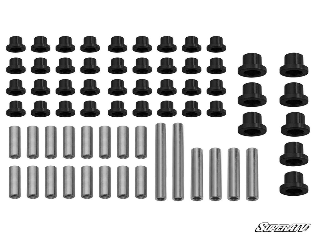 The image displays the Can-Am Defender A-Arm Bushings: 32 black cylindrical bushings and 16 metal sleeves arranged in rows on a white background, with the SuperATV logo in the bottom right corner.
