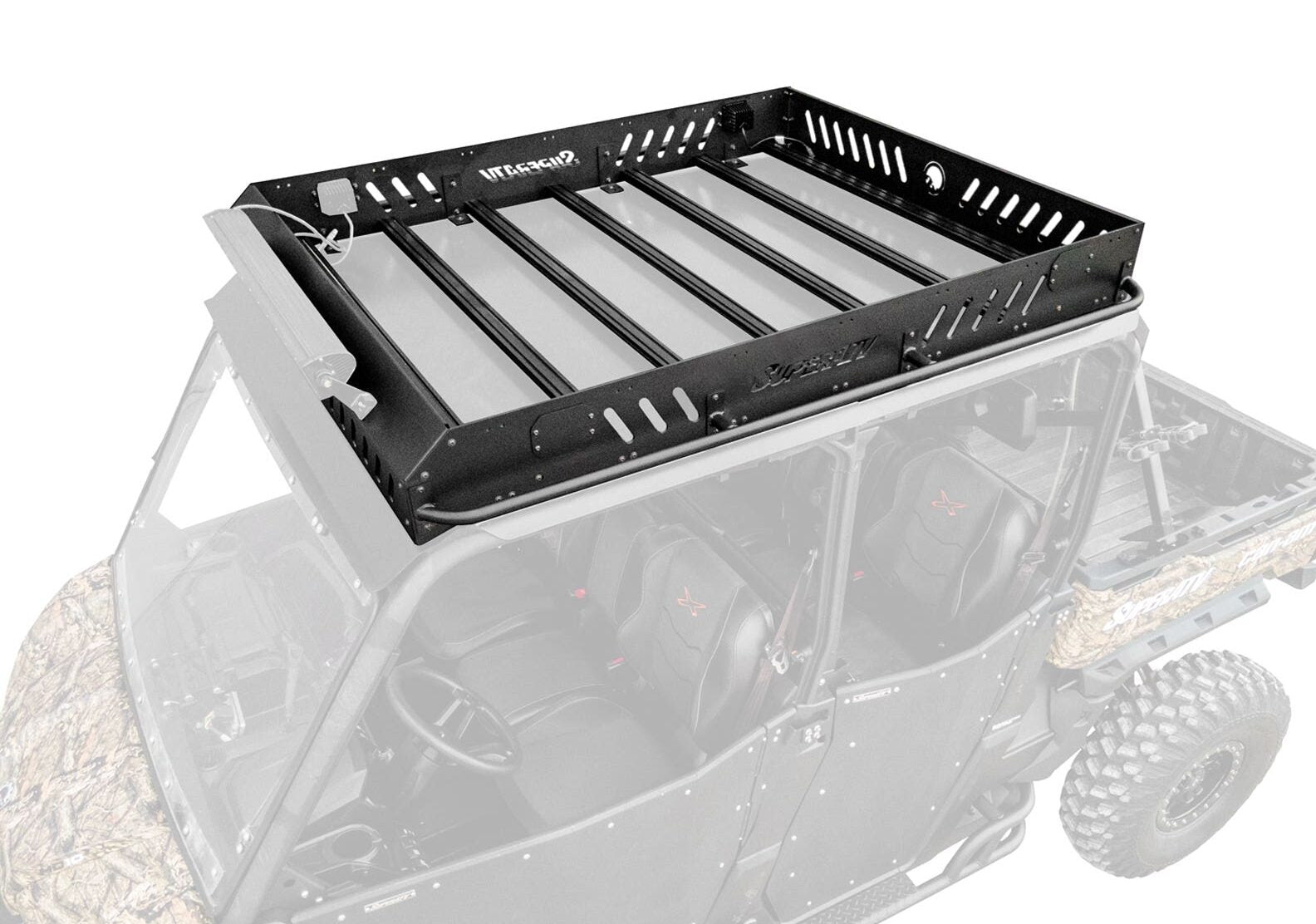 A close-up of the Can-Am Defender MAX Outfitter Roof Rack, a black metal rack with slotted sides and reinforced crossbars, mounted on a camouflage-patterned off-road vehicle against a partially faded background.
