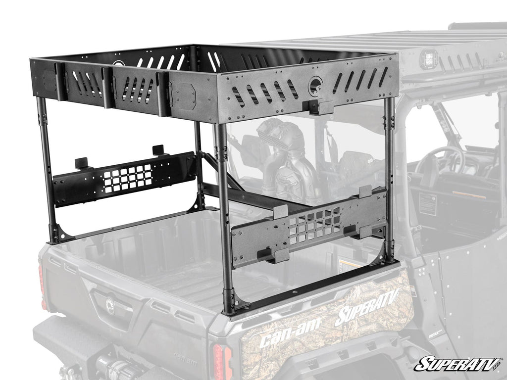 The Can-Am Defender MAX Outfitter Bed Rack, made of black metal and plastic, attaches to your UTV bed. Shown in vibrant detail on a semi-transparent vehicle, it features slotted panels and mounting holes for securing your gear.