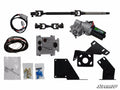 The Can-Am Defender Power Steering Kit is displayed, featuring a motor assembly, wiring harness, control module, steering shaft, U-joints, black brackets, bolts, and connectors neatly arranged on a white background.