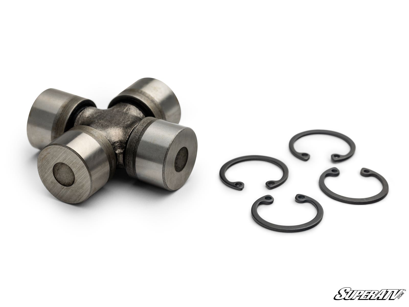 The Up & Running Can-Am Replacement U-Joint, featuring four cylindrical ends, is shown on a white background with four black retaining clips to the right and the SuperATV logo in the bottom right corner.