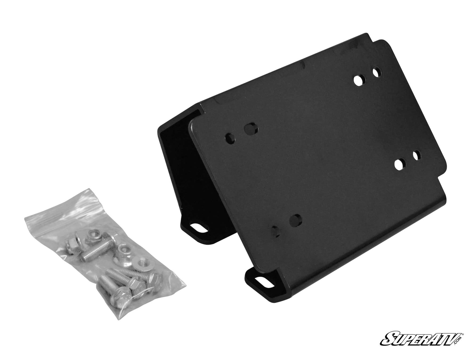 A Can-Am Defender Winch Mounting Plate in black metal with multiple pre-drilled holes is shown beside a small plastic bag of assorted screws and bolts, set against a white background with the SuperATV logo in the bottom right corner.