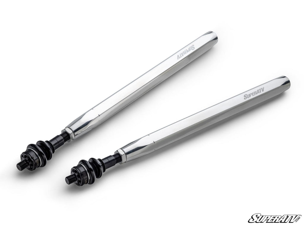 Two shiny Can-Am Maverick R Billet Hex Tie Rods with black mounting hardware are shown on a white background. Each shaft is engraved with SUPERATV and ALUMINUM. The SuperATV logo is in the bottom right corner.