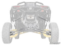 Rear view of an off-road vehicle highlighting its suspension system, focusing on the SuperATV Can-Am Maverick R Billet Aluminum Hex Radius Arms connecting the wheels to the chassis. Faded vehicle parts; SuperATV logo in corner.