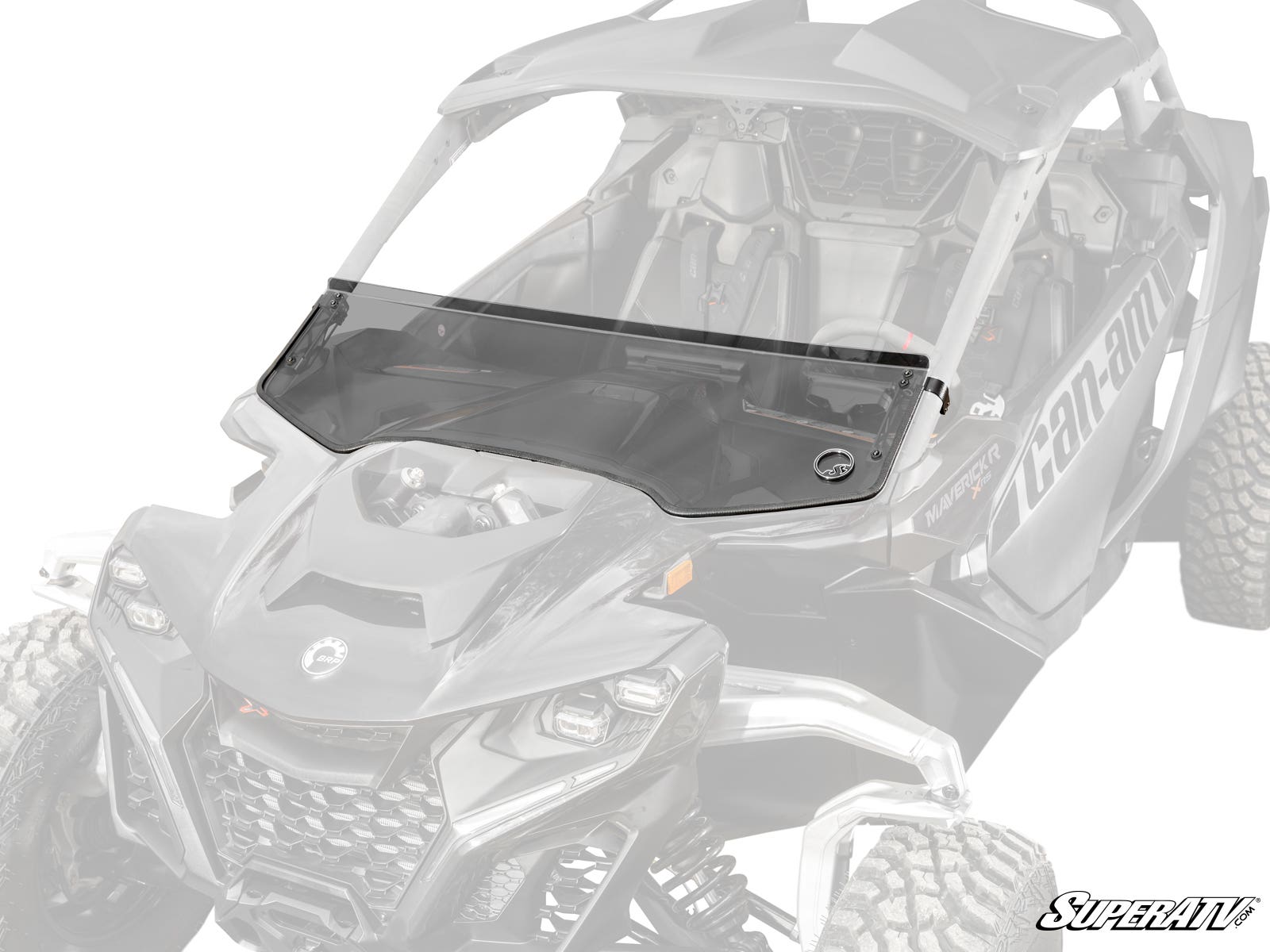 A Can-Am Maverick R Half Windshield, made of tinted polycarbonate with a vent for airflow, is installed on a rugged black Maverick side-by-side. The windshield covers the front cockpit; the vehicle is partially faded to highlight it.