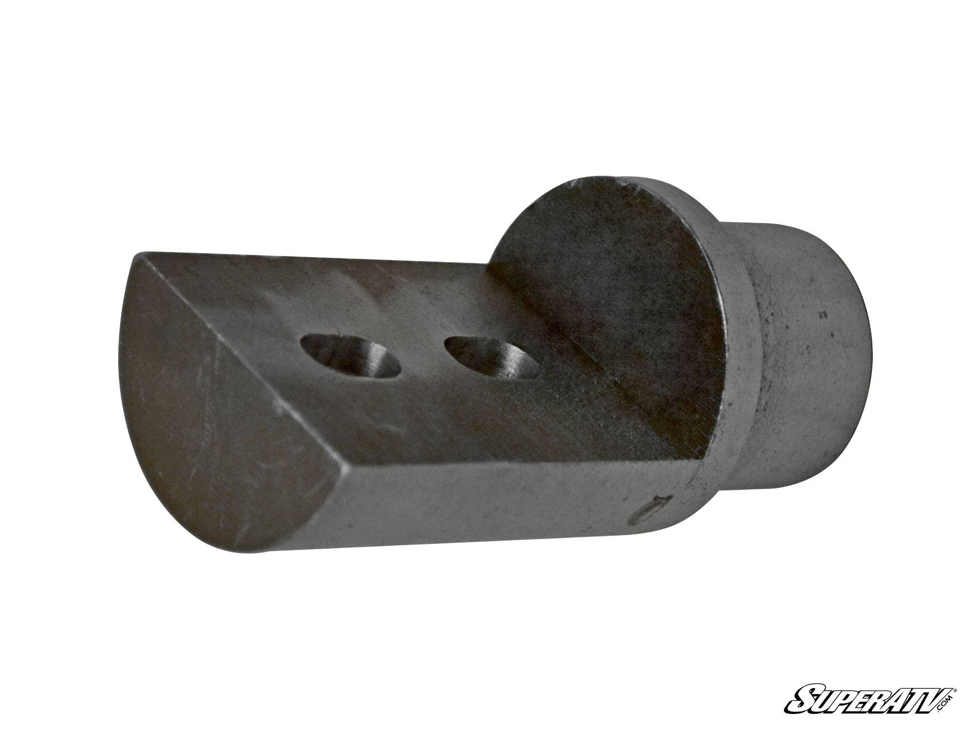 Close-up of a Can-Am Maverick Weld-In Front Cage Mount—small, cylindrical bracket with a flat, semicircular base and two drilled holes. Matte metal finish; isolated on a white background. SuperATV in stylized text appears at the bottom right.
