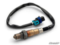 A close-up of the Up & Running Can-Am Maverick Sport O2 Sensor shows its metallic and bronze body with threading, a black flexible cable, and a blue-and-black connector on a white background. The SuperATV logo is in the bottom right corner.