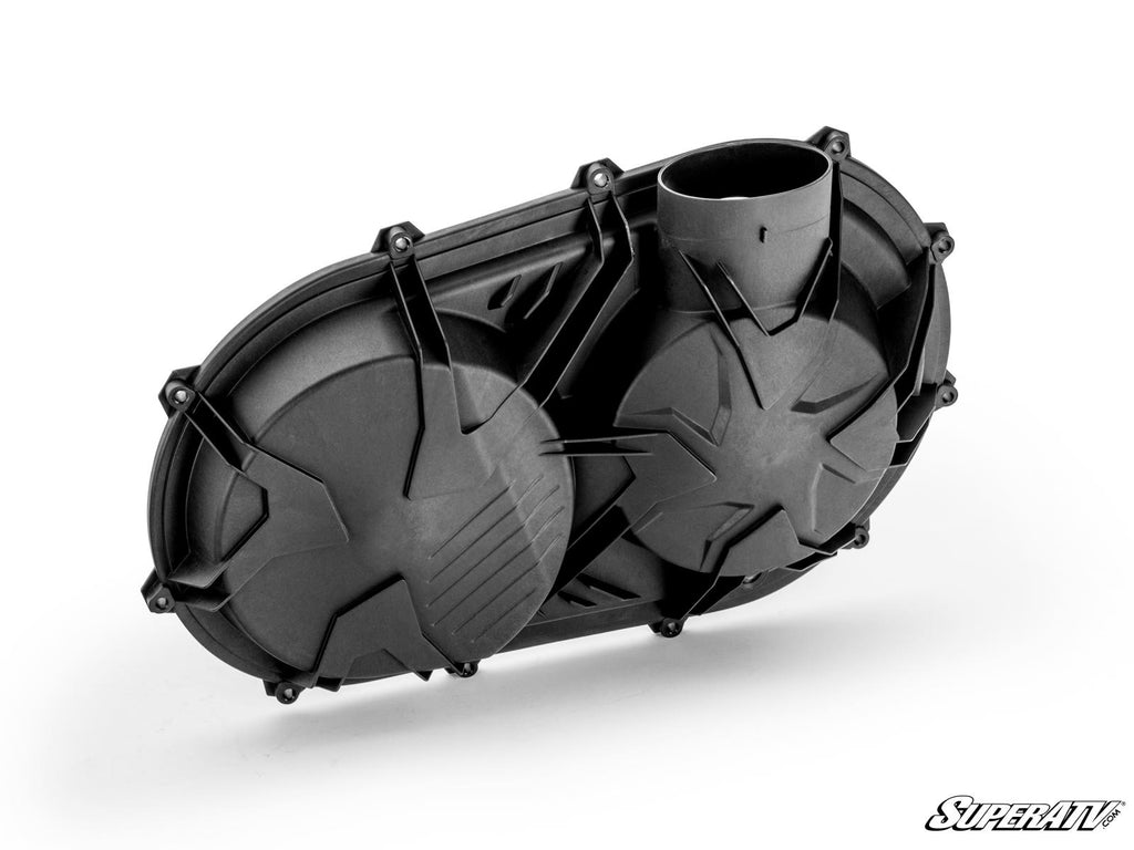 The Up & Running Can-Am Maverick X3 Clutch Cover is a black, oval clutch cover with angular surface patterns, multiple bolts around the edges, and a cylindrical snorkel extension on the upper right. The SuperATV logo is in the bottom right corner.