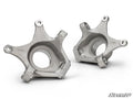 Two silver, machined metal Up & Running Can-Am Maverick X3 Rear Knuckle components for off-road vehicles are shown on a white background, each with multiple mounting holes and a large central circular opening. SuperATV branding appears bottom right.
