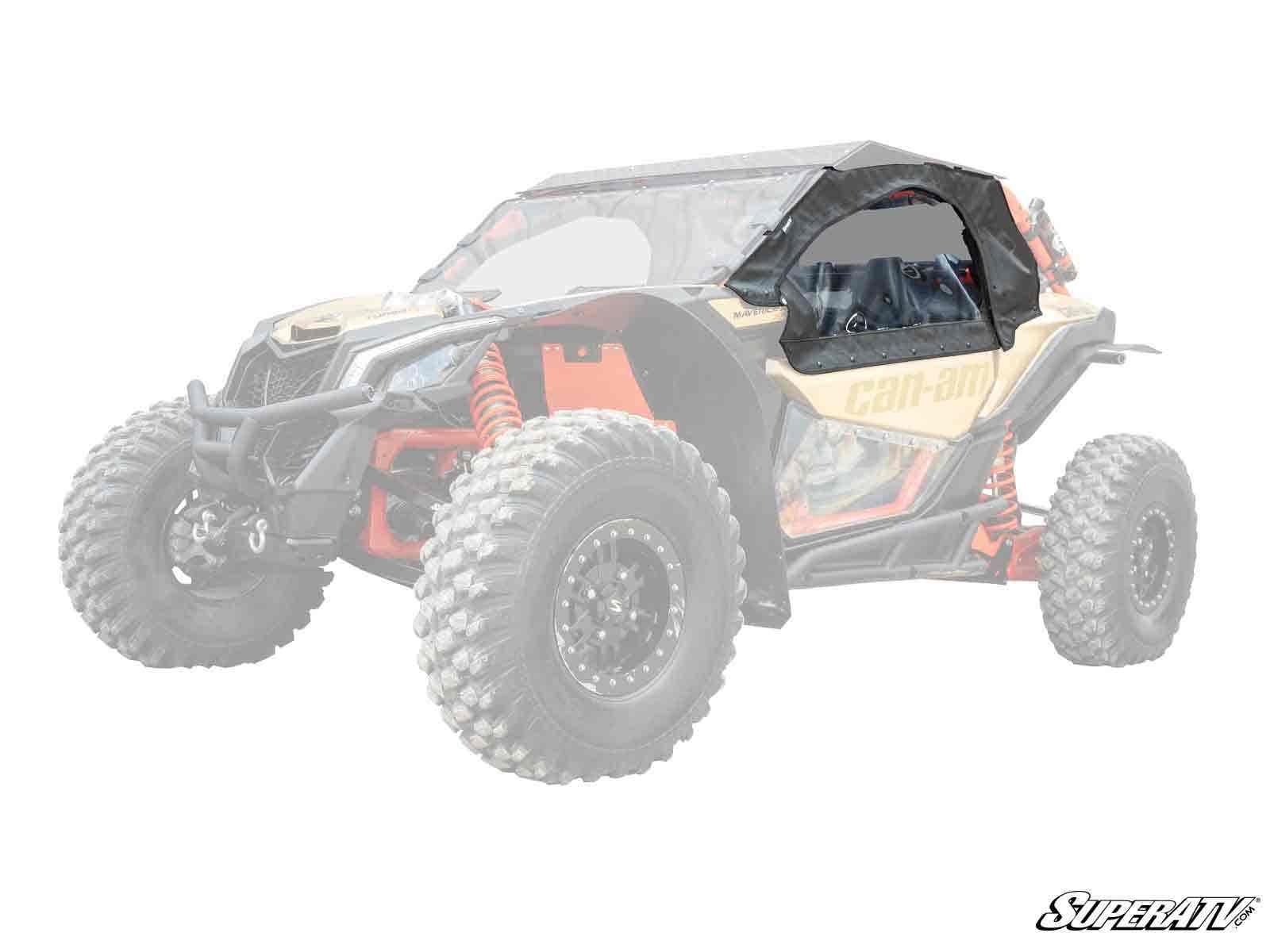 A Can-Am Maverick X3 in yellow and black features Primal Soft Cab Enclosure Upper Doors with clear windows over the cab, contrasting with the vehicle’s faded body. The SuperATV logo appears in the lower right corner.