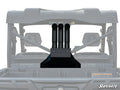 A rear view of a black off-road vehicle features the Can-Am Defender Depth Finder Snorkel Kit, with three SuperATV-branded vertical intake tubes behind the cab. The white background highlights the snorkel kit and vehicle structure.