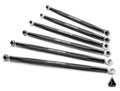 Six black metal Assault Industries Can-Am Maverick R Turret Style Quick Camber Radius Rods with spherical rod ends are arranged diagonally on a white background. Each arm features white branding, with a small geometric logo in the lower right corner.