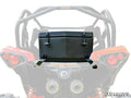 A Can-Am Maverick Cooler / Cargo Box with two latches is mounted on the rear rack of a red off-road side-by-side vehicle. The faded white background features the SuperATV logo in the bottom right corner.