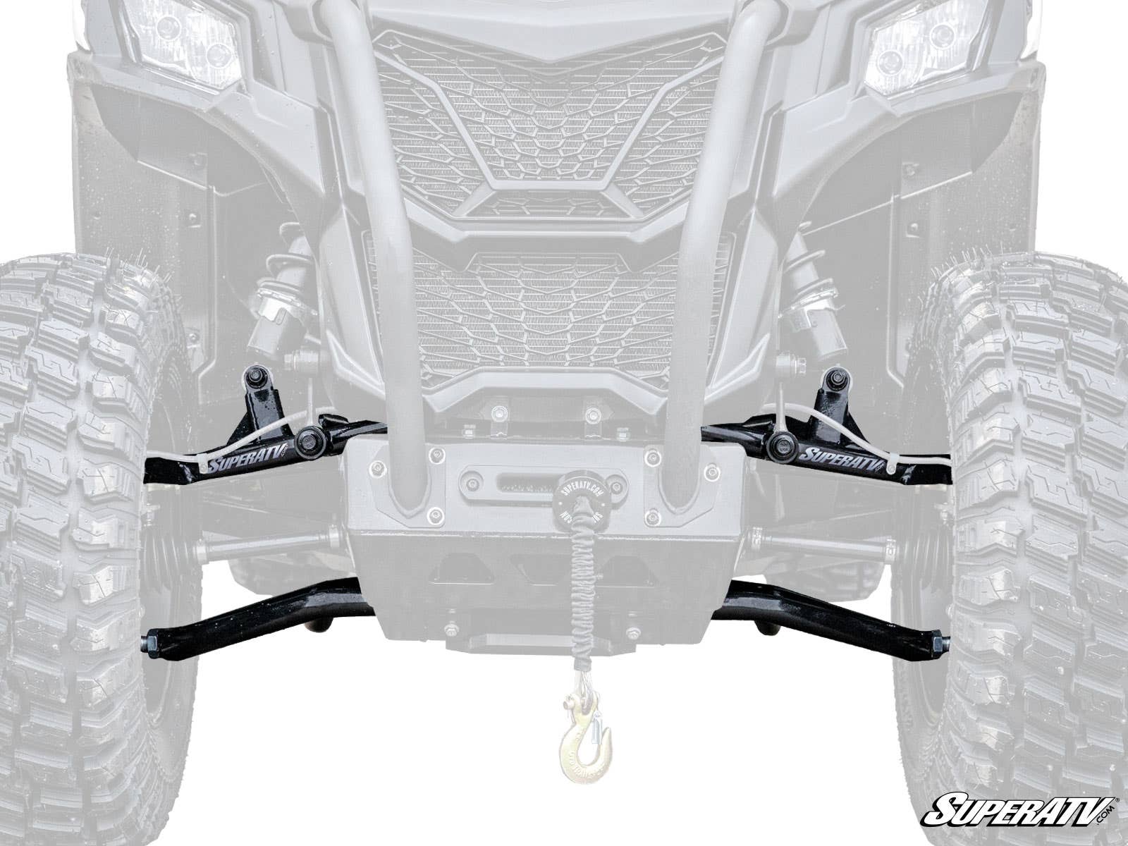 Close-up of Can-Am Maverick Trail High Clearance 1.5 Forward Offset A-Arms, showing large off-road tires, SuperATV suspension arms, a central winch with hook, and rugged front grille. Faded background vehicle highlights the new A-Arms.