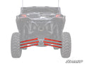 Rear view of an off-road vehicle with large, rugged tires, highlighting four bright red Can-Am Maverick X3 Boxed Radius Arms attached to the suspension under the back. The background vehicle is faded to emphasize the radius arms.